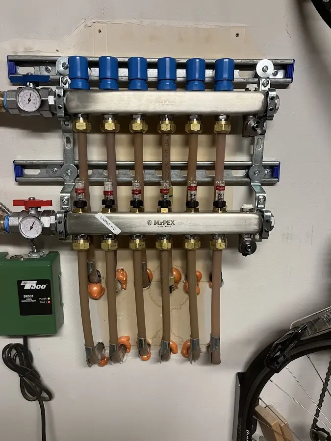 Plumber performing Water Heater Repair at a residential property in Wisconsin Rapids